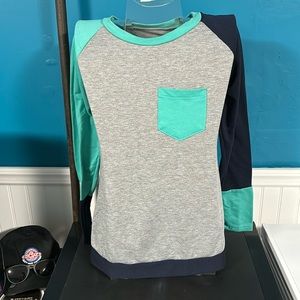 Woman’s Long sleeve shirt. Unknown brand. Size Medium